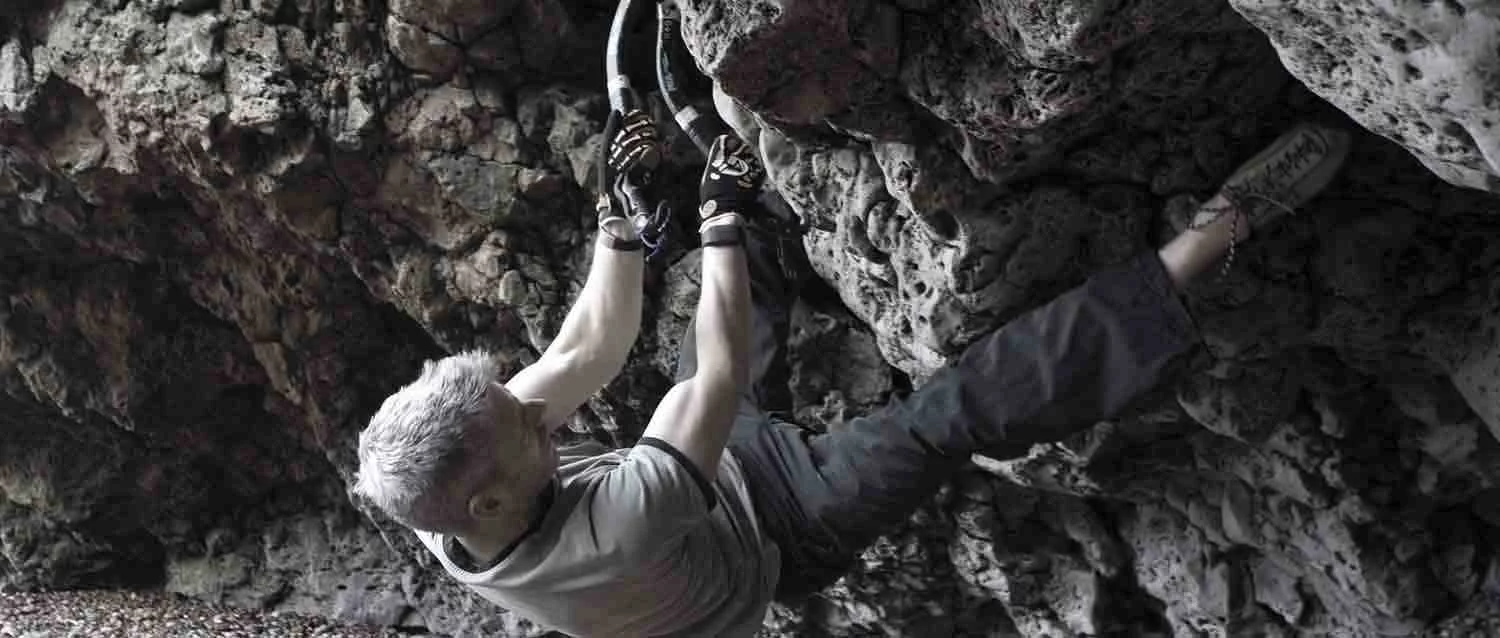 A climber wearing the ClimbAX wristbands