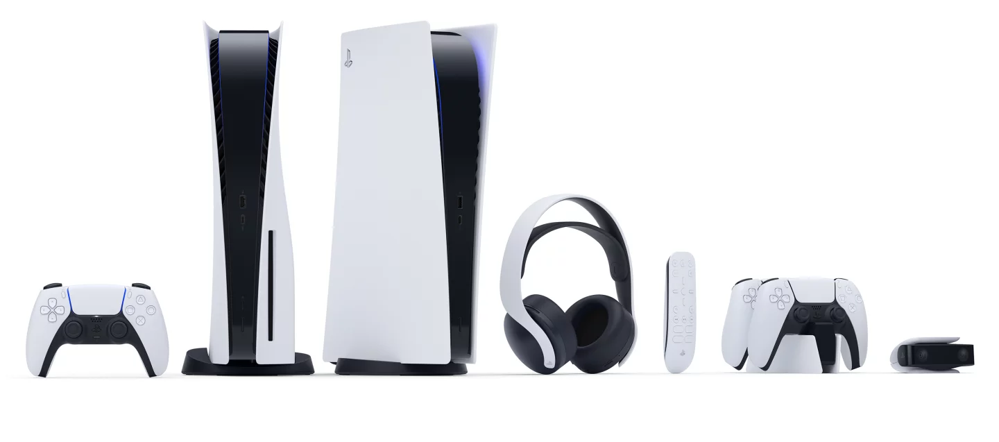 The full Sony PlayStation 5 hardware lineup, from left: DualSense controller, PS5 console with disc slot, digital-only PS5 console, Pulse 3D Wireless Headset, Media Remote, DualSense Charging Station, HD Camera