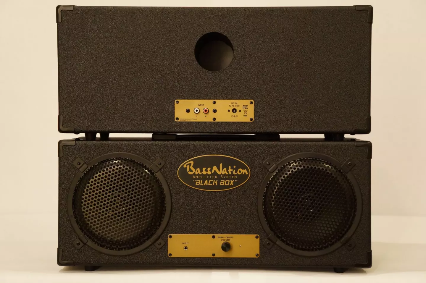 Front and back, showing the bass porting and 6.5-inch mid woofers