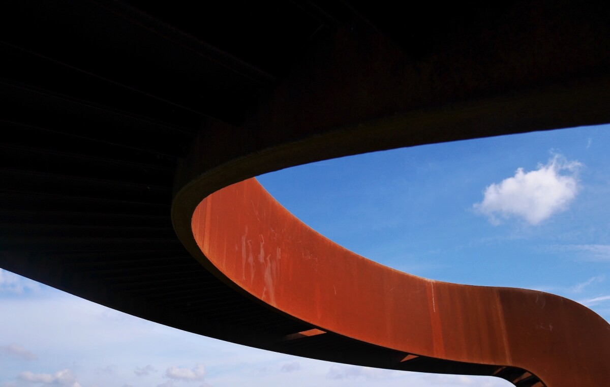 This third-place runner-up by EyeEm user urban poetry frames the curves of a corten steel bridge