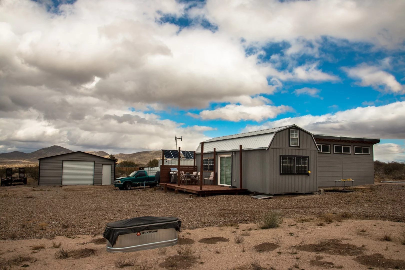 The front of his property. I asked him if he had horses; he laughed and said no, the trough is his "redneck hot tub." Inside the trough, he has a 1500 watt water heater to heat up the water quick when he wants to lounge in the "hot tub."