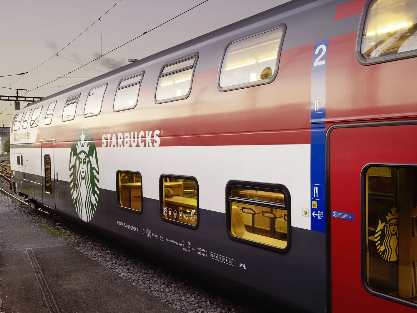 The carriage is a double-decker designed to serve short-journey passengers