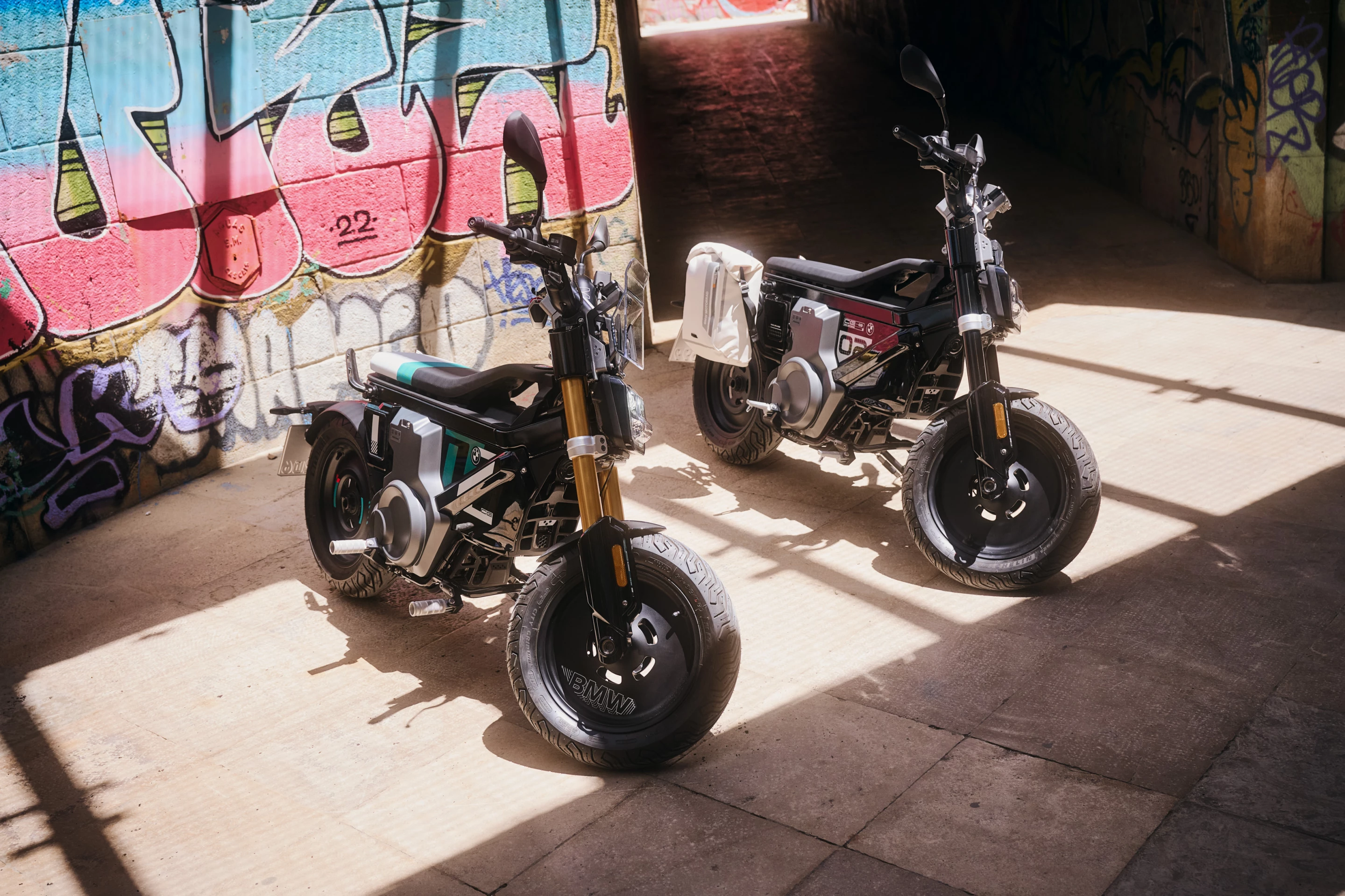 A Highline version of the 2024 CE 02 (left) is available, with gold forks, more decals, a tri-color seat, a smartphone dock, heated grips, and an extra ride mode