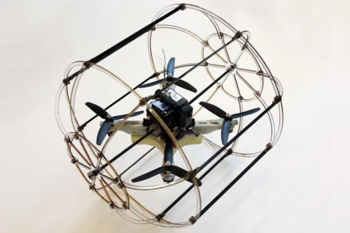 The cylindrical cage of the HyTAQ (Hybrid Terrestrial and Aerial Quadrotor) gives the robot both aerial and rolling terrestrial locomotion capabilities (Photo: