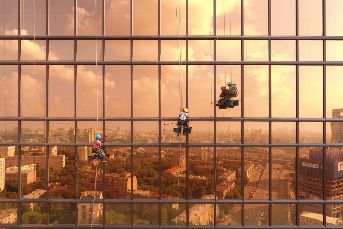 Workers tend to the Mercury Tower in Moscow