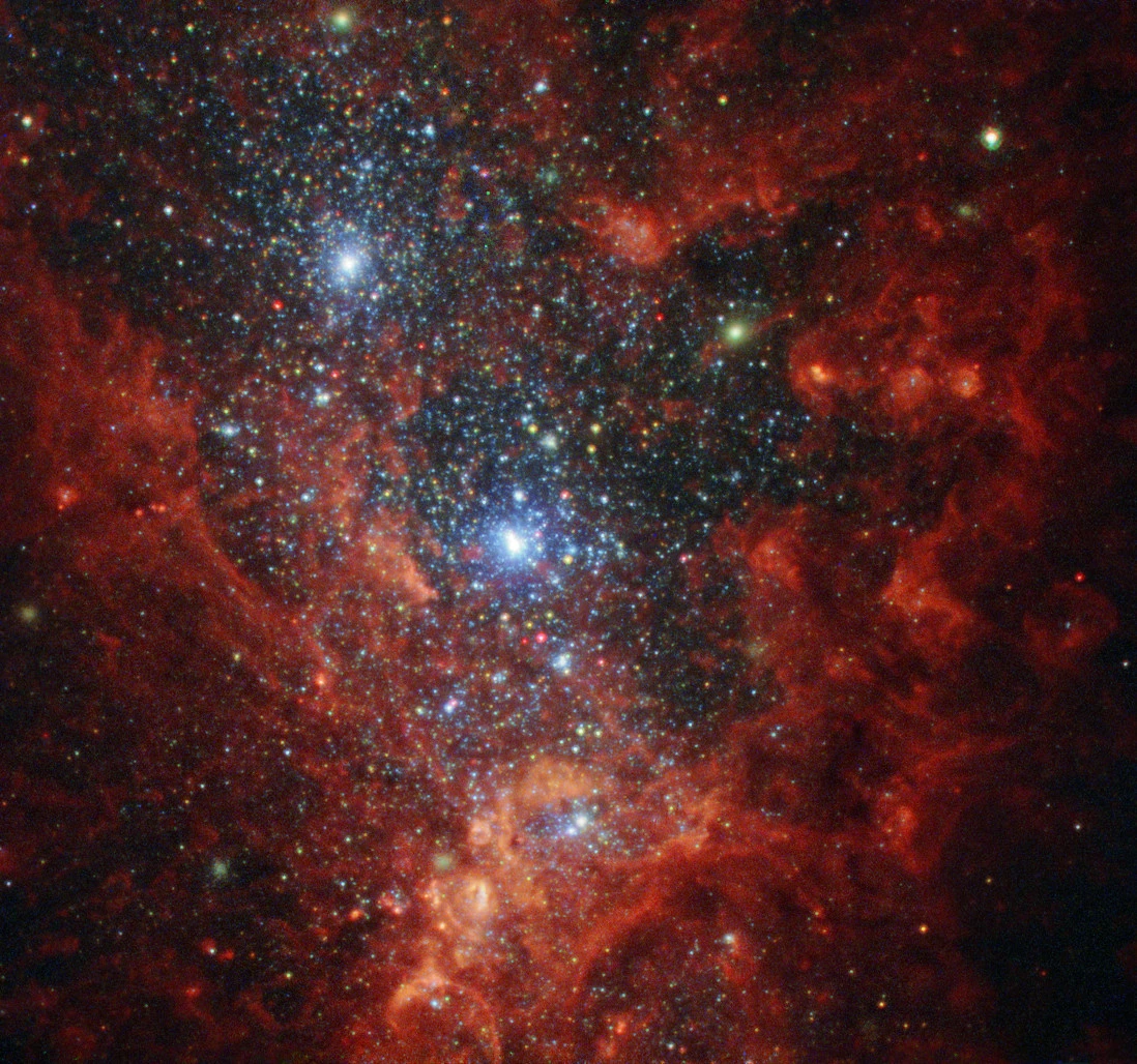 his NASA/ESA Hubble Space Telescope image reveals the iridescent interior of one of the most active galaxies in our local neighbourhood — NGC 1569, a small galaxy located about eleven million light-years away in the constellation of Camelopardalis (The Giraffe)