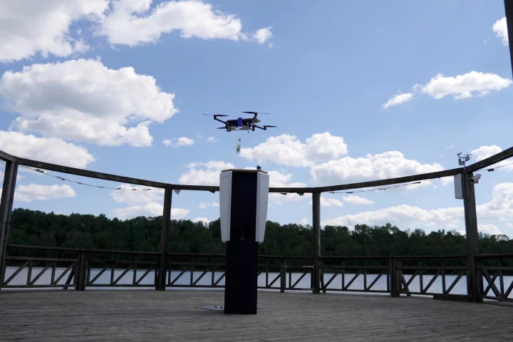 A quadcopter drops a bottled beverage into the CleverNest