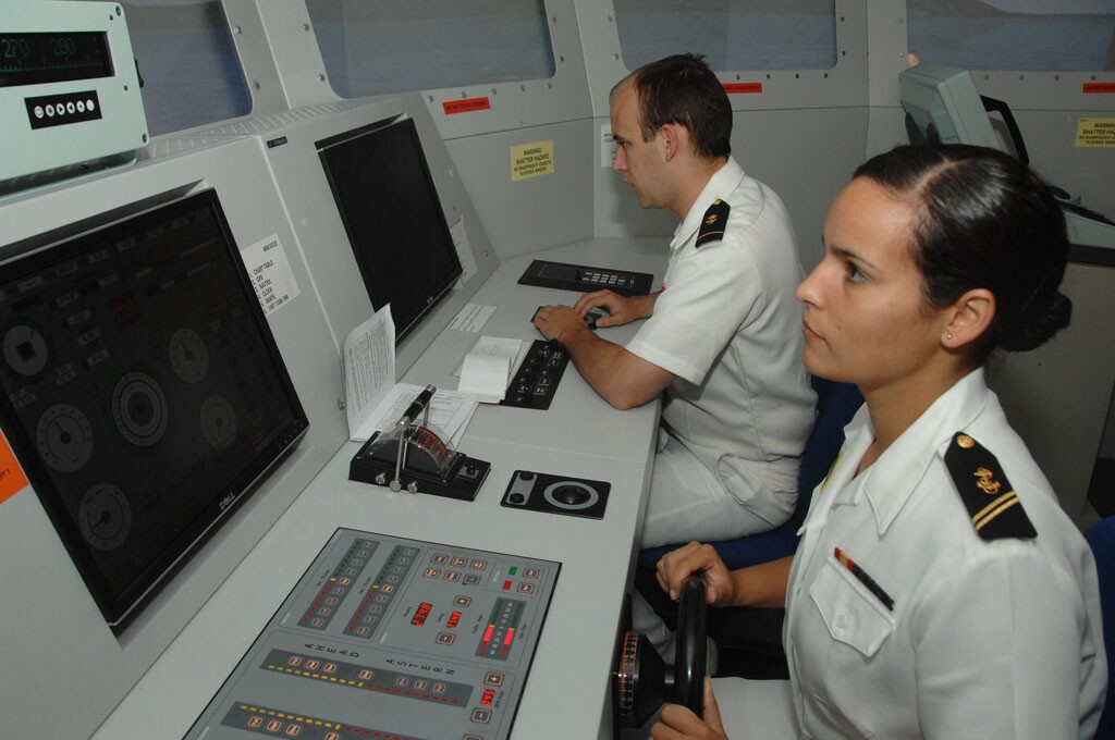 Two US Navy midshipman at the simulator controls