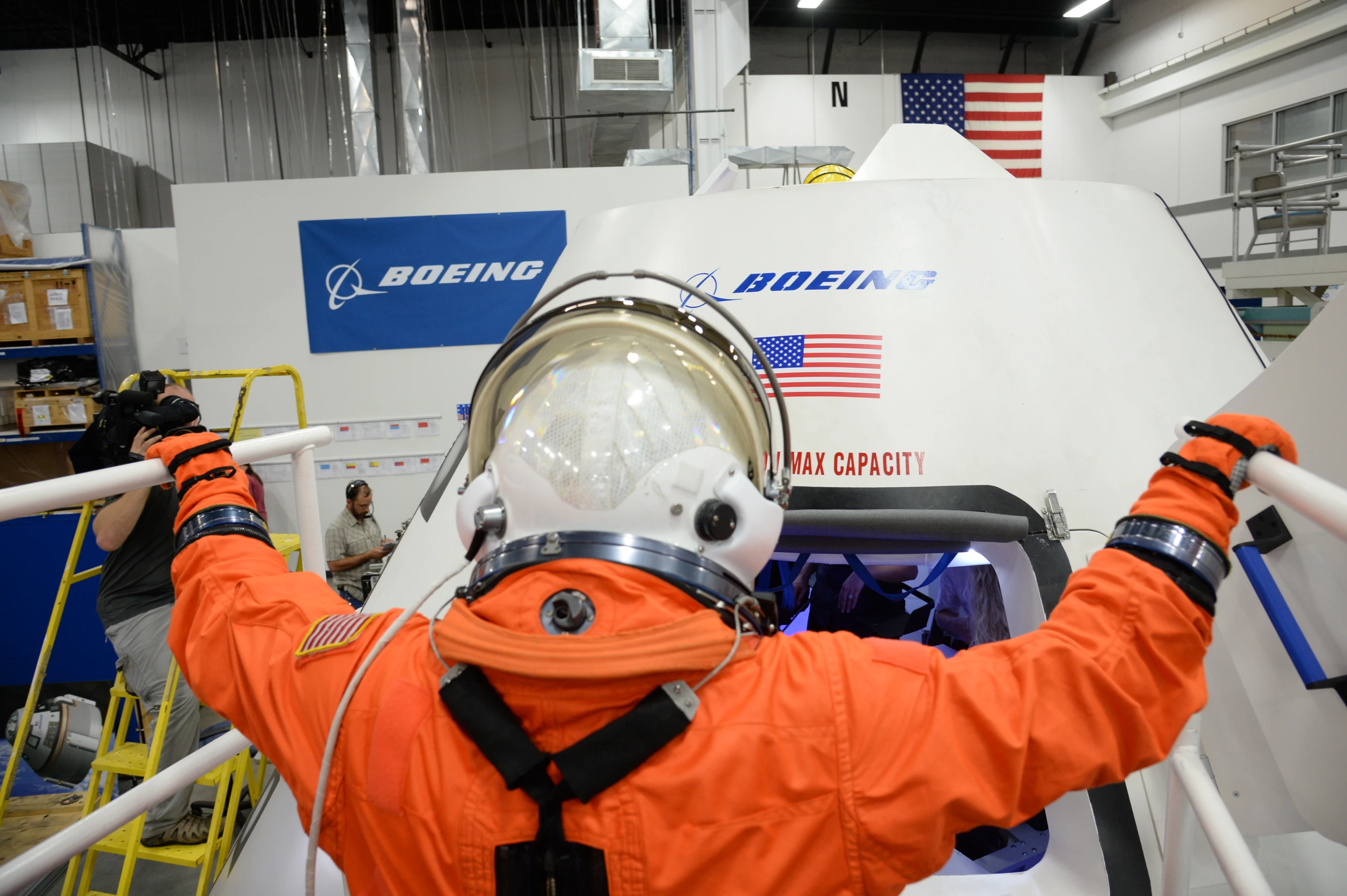 NASA astronaut Serena Aunon entering the CST-100 mock up (Photo: NASA/Robert Markowitz)