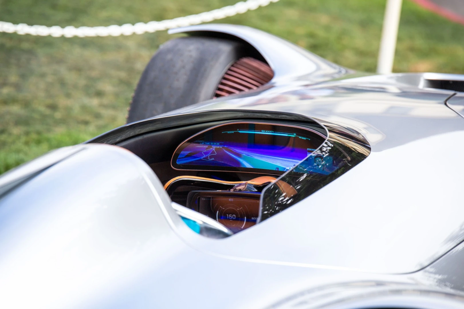 A screen built into the steering wheel is shadowed by another serving as the instrument panel, which can also be used to play with Mercedes' virtual racing software