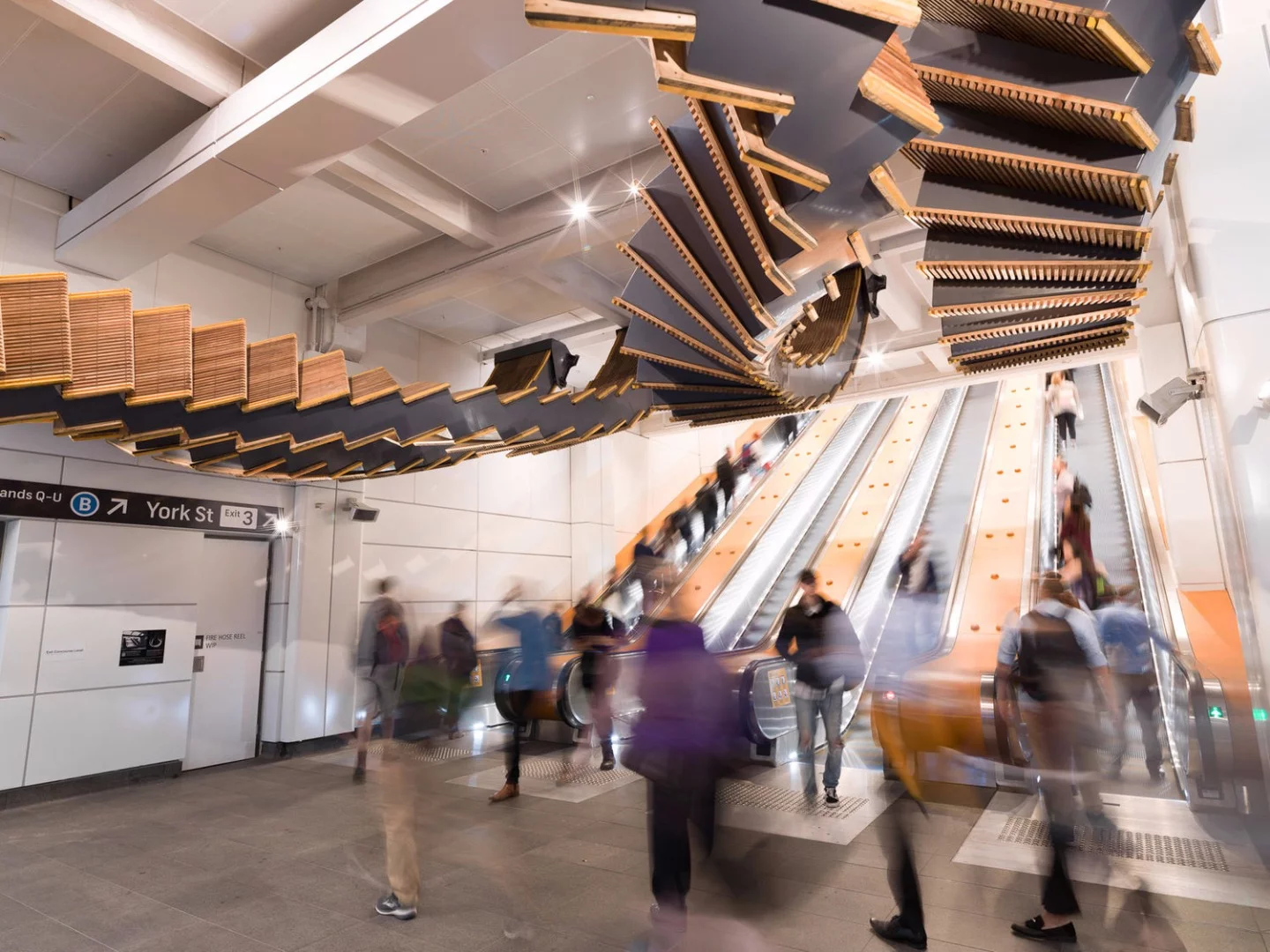 The Interloop sculpture consists of 244 reclaimed wooden escalator treads