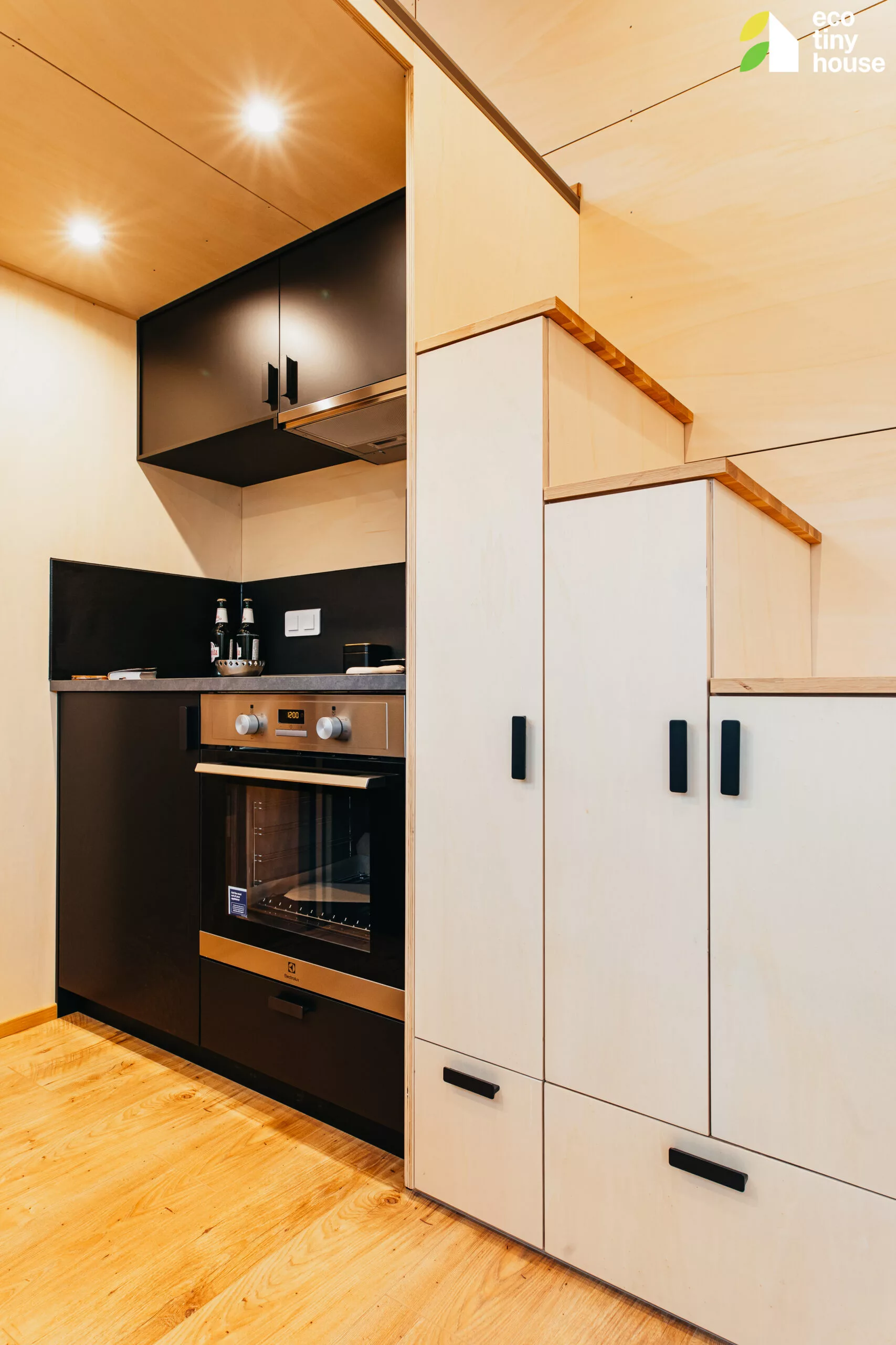The Tiny Hogwarts' kitchen has quite a lot of cabinetry for a tiny house
