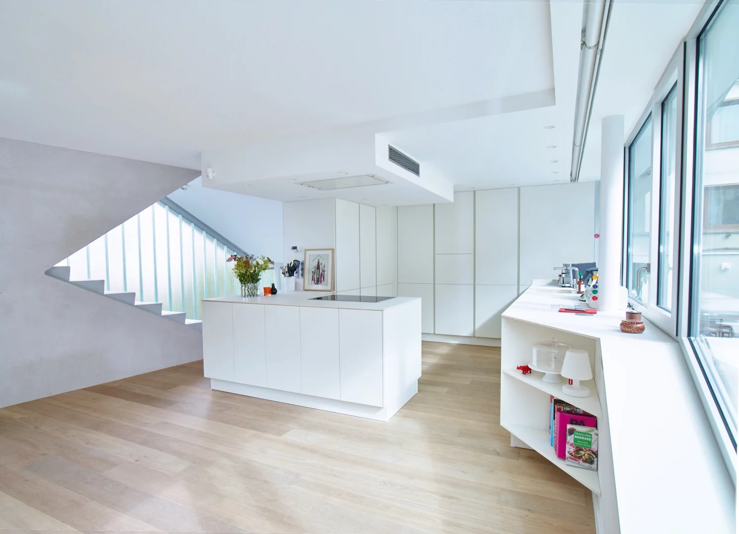 The ground floor features the home's shared spaces, including kitchen, lounge, dining area and master bathroom