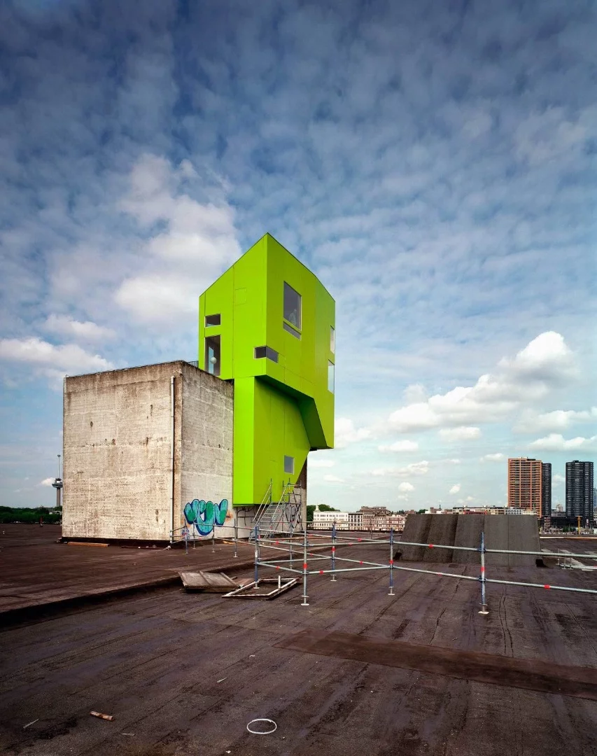 The Green Exhibition House appeared in Rotterdam in 2001, designed as an experiment in assembling a prefabricated structure onto an existing building. In true parasitic fashion, the water pipes, sewage and electricity were all tapped from existing connections in the base building
