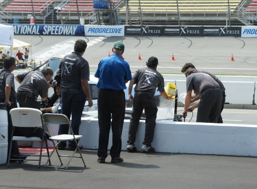 The Edison 2 team cool the engine of the Very Light Car during the 200 mile range test
