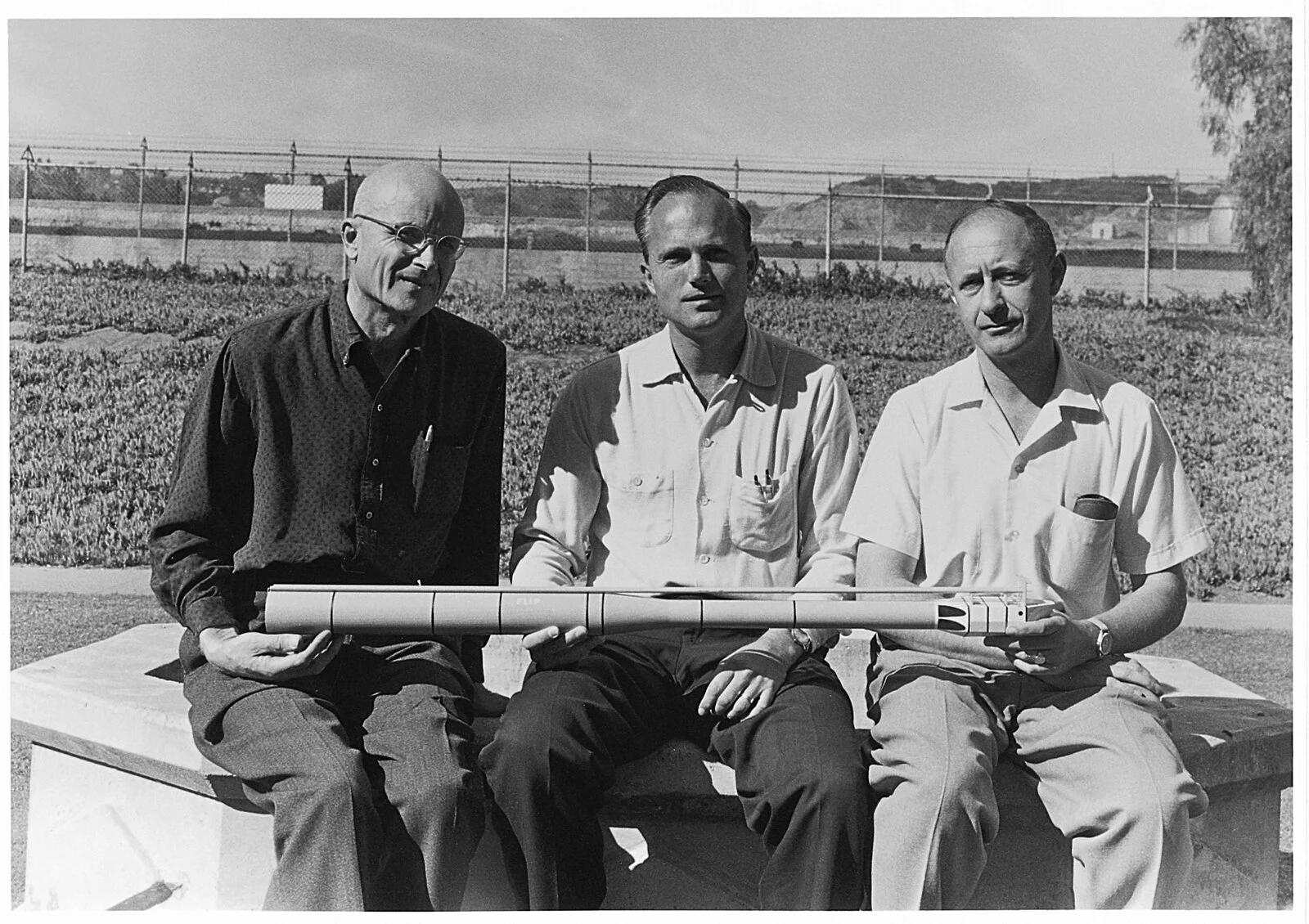 The designers of FLIP with a scale model