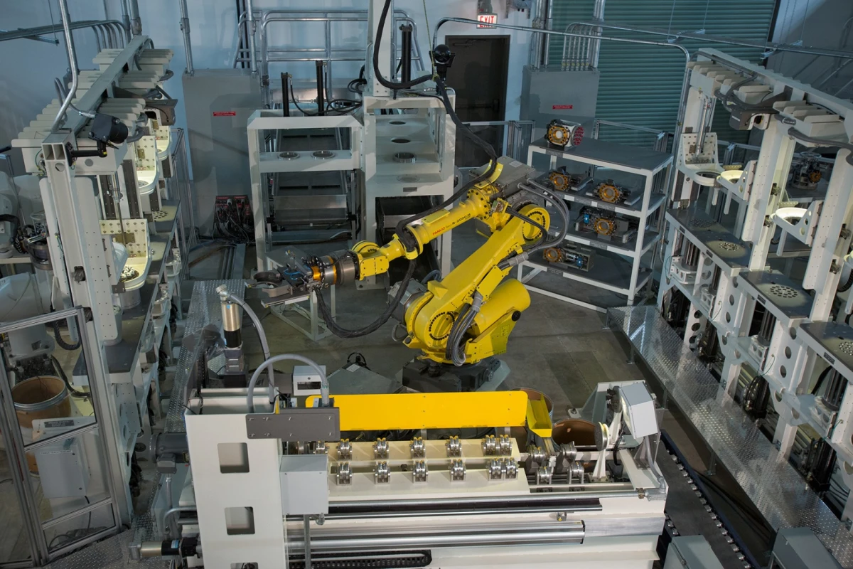 This automated system demilitarizes warheads by cutting them into separate sections, removing foam packs filled with grenades and detaching grenade fuses