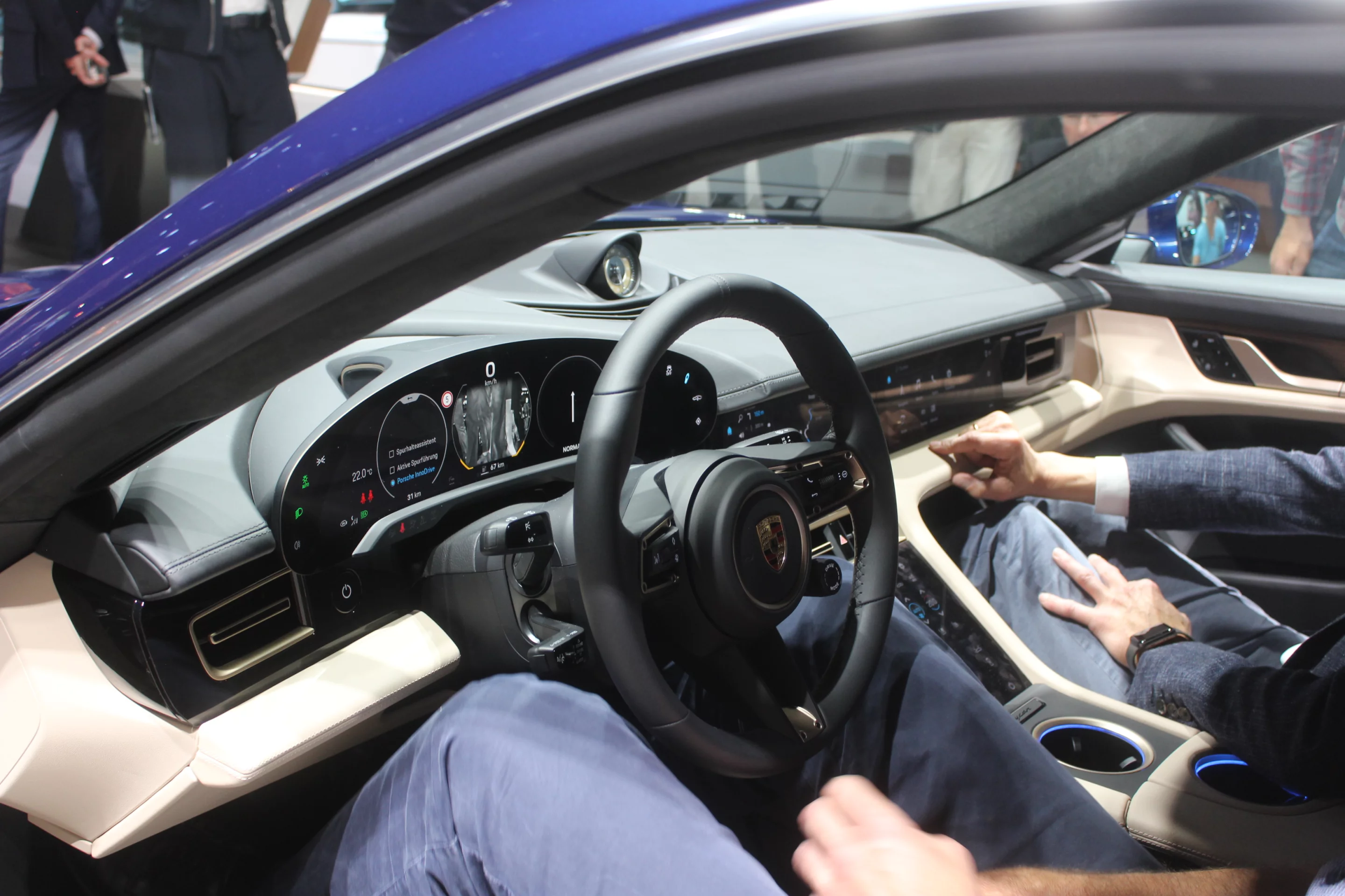 The curved digital instrument panel is a highlight of the Taycan's interior design and feels much more natural than the flat instrument displays of some other designs