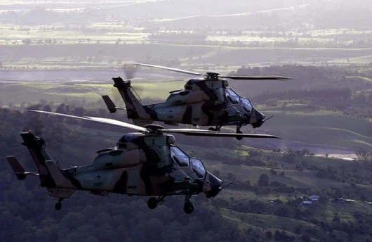 Two Australian Army "Tiger" Armed Reconnaissance Helicopters on their inaugural flight as part of the Australian Defence Force. Photo by Able Seaman Phillip Cullinan Photo courtesy: Australian Department of Defence
