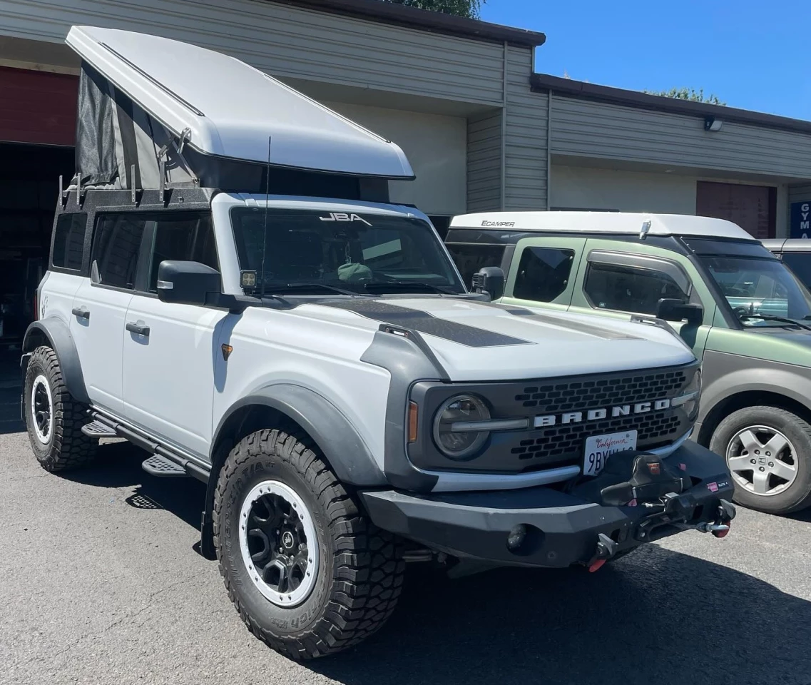 After several years of development, Ursa Minor rolls the Bronco pop-top camper roof out of its garage