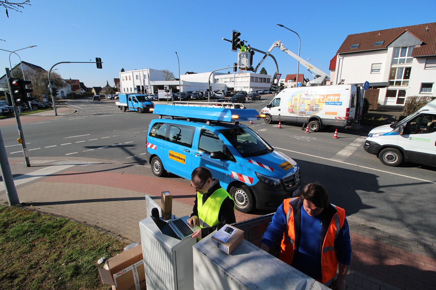 Workers install cameras and radar sensors at the intersection which was used as a model for the study
