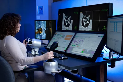 An operator at the helm of the Mission Operations Station