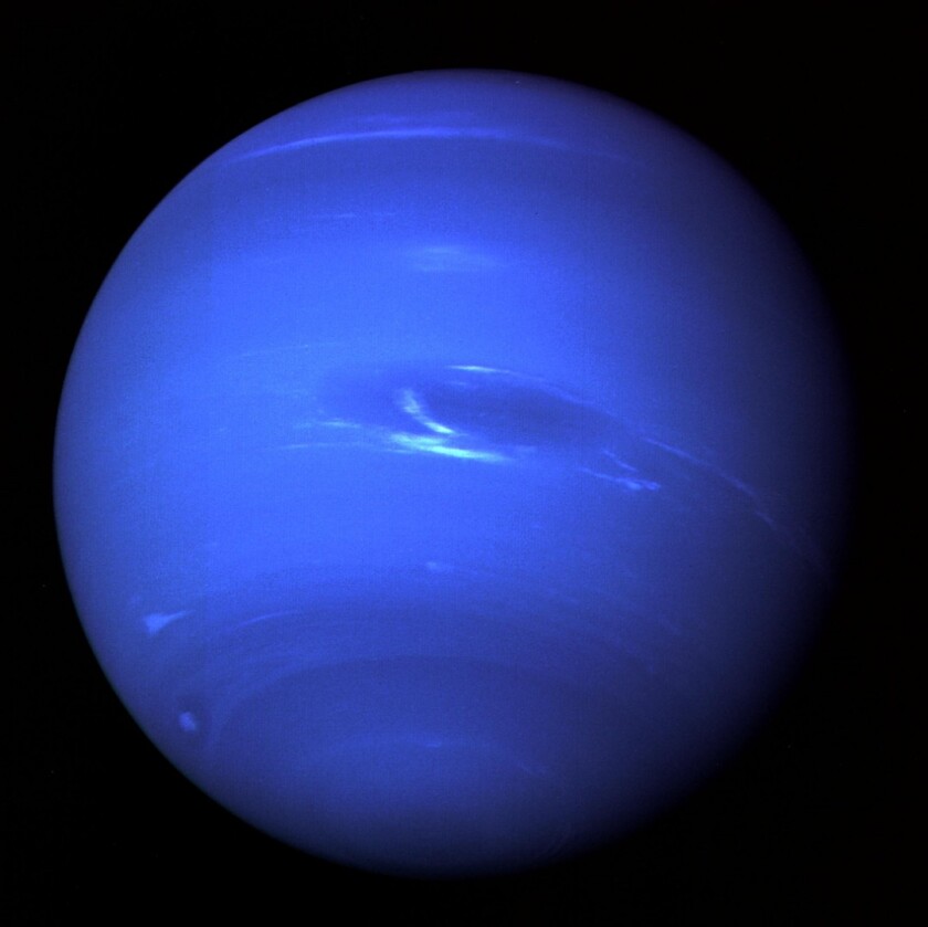 A composite image of Neptune taken by Voyager 2 in 1989, with the "Great Dark Spot" visible in the center