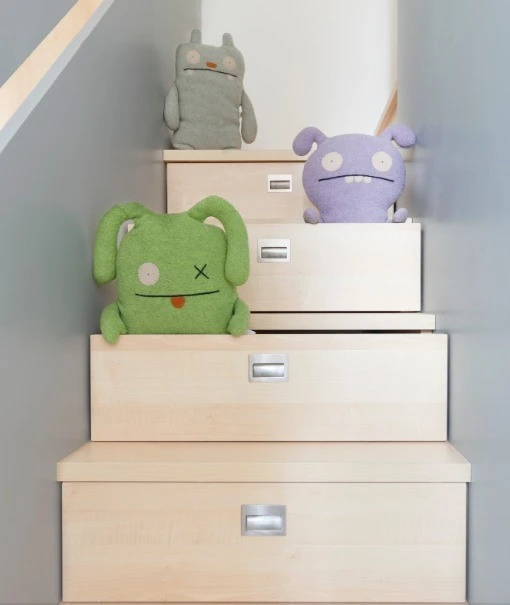 Additional storage can be found hidden within the wooden steps, which provide access to the elevated bed loft