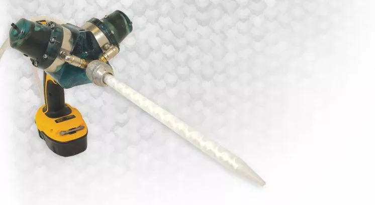 The Dra-gun is a drill-powered device for mixing and applying two-part liquids such as resin