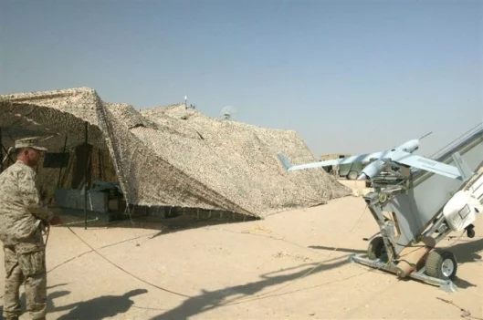 The catapult launcher and Scan Eagle prepare to go into battle