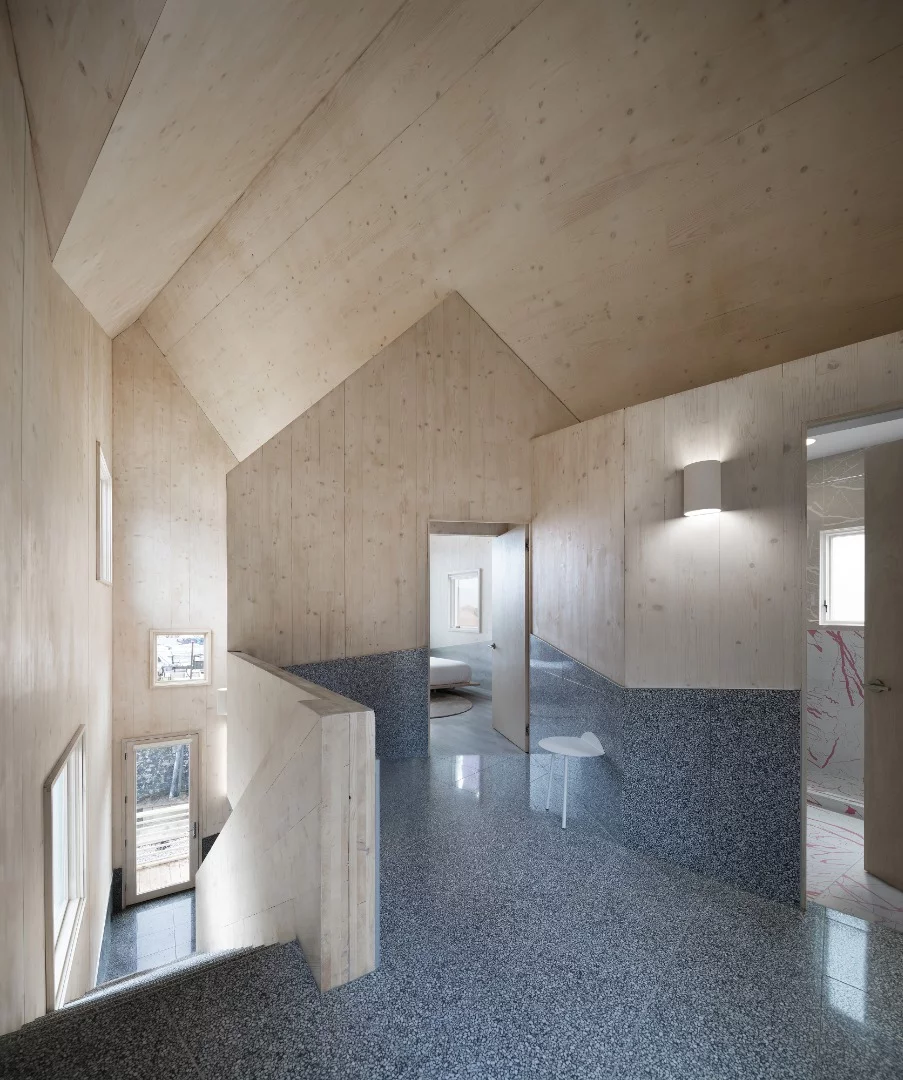 The unique roofline of Haus Gables is used to structure and organize the home’s interior space and layout