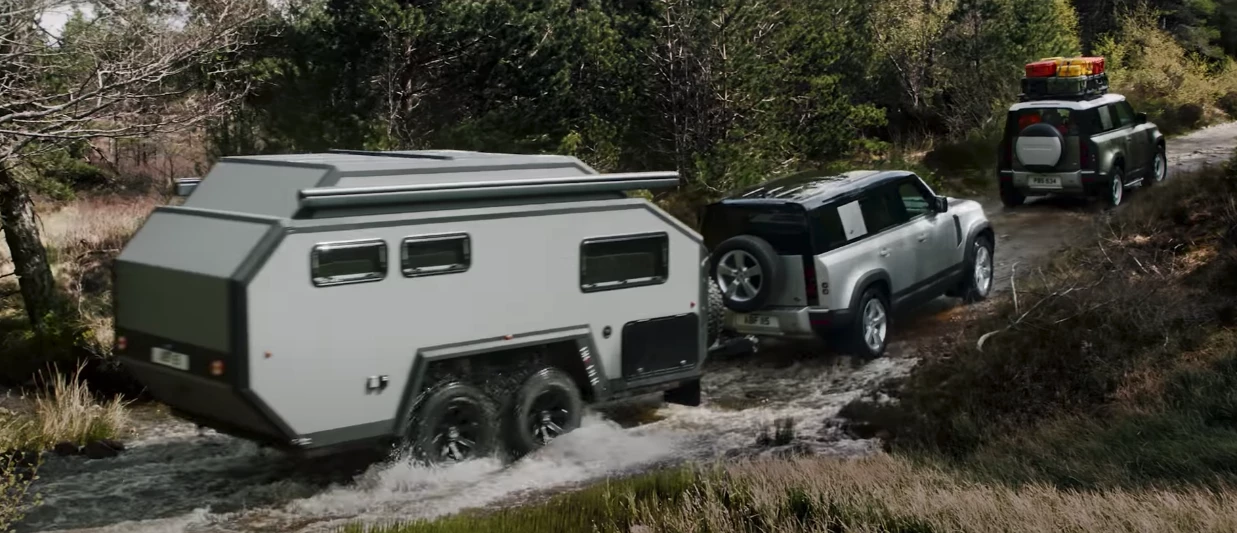 Land Rover showed the Defender towing a Bruder EXP-6 GT in one of its introductory videos last September