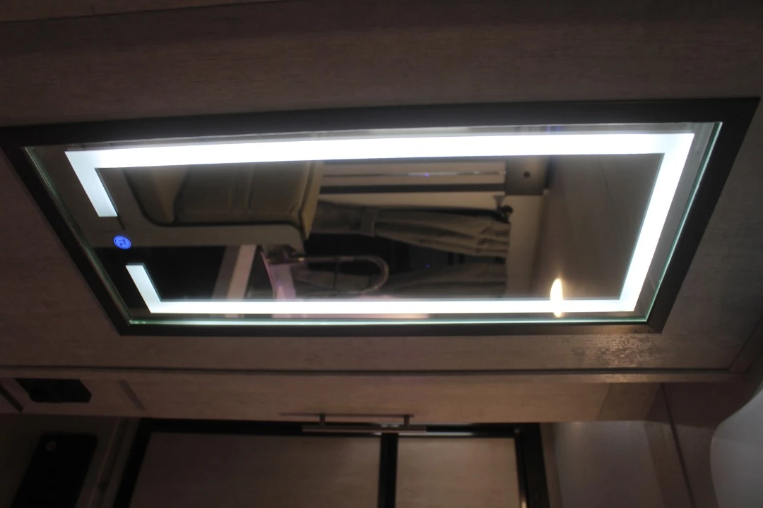 A touch-panel lighted mirror adds to the bright, well-lit ambiance of the Evoke trailer series