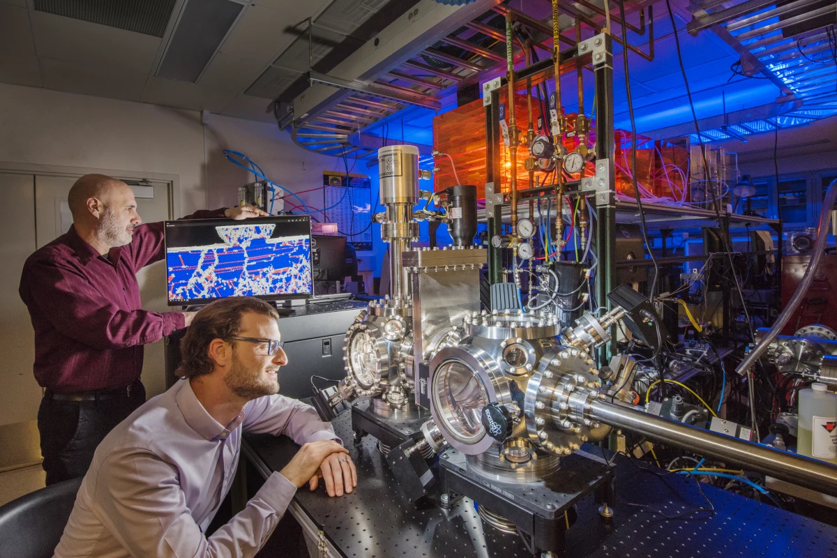 Sandia researchers Michael Chandross (left) and Nic Argibay, overseeing the testing of the platinum-gold alloy that's now the world's most durable alloy