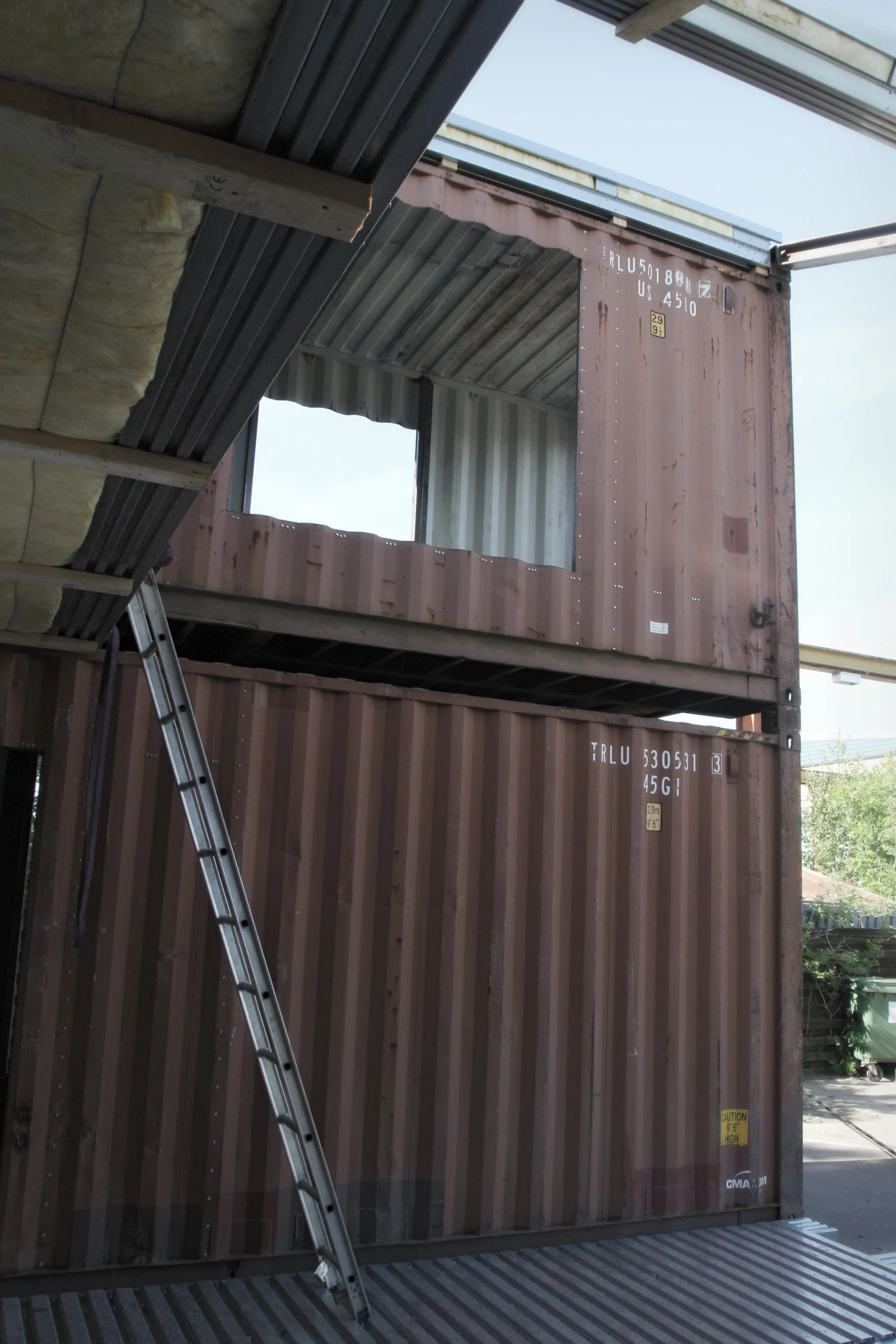 Two rows of container modules are stacked on top of one another