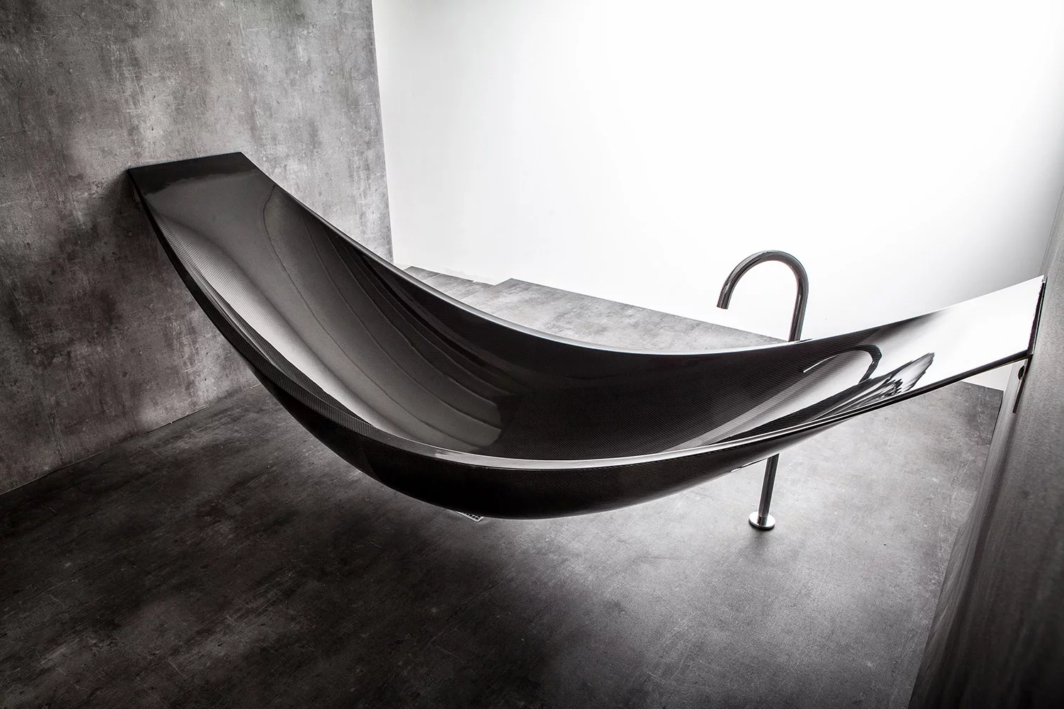 Design group Splinter Works' latest piece of furniture, the Vessel, is a sleek-looking bathtub suspended in the air like a hammock