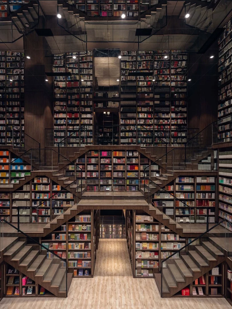 Staircases double as bookshelves inside the Chongqing Zhongshuge Bookstore