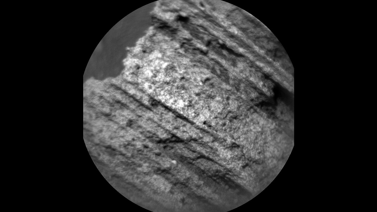 First image snapped by the ChemCam instrument following the fix, displaying the texture of a "yellowjacket" rock on Mount Sharp