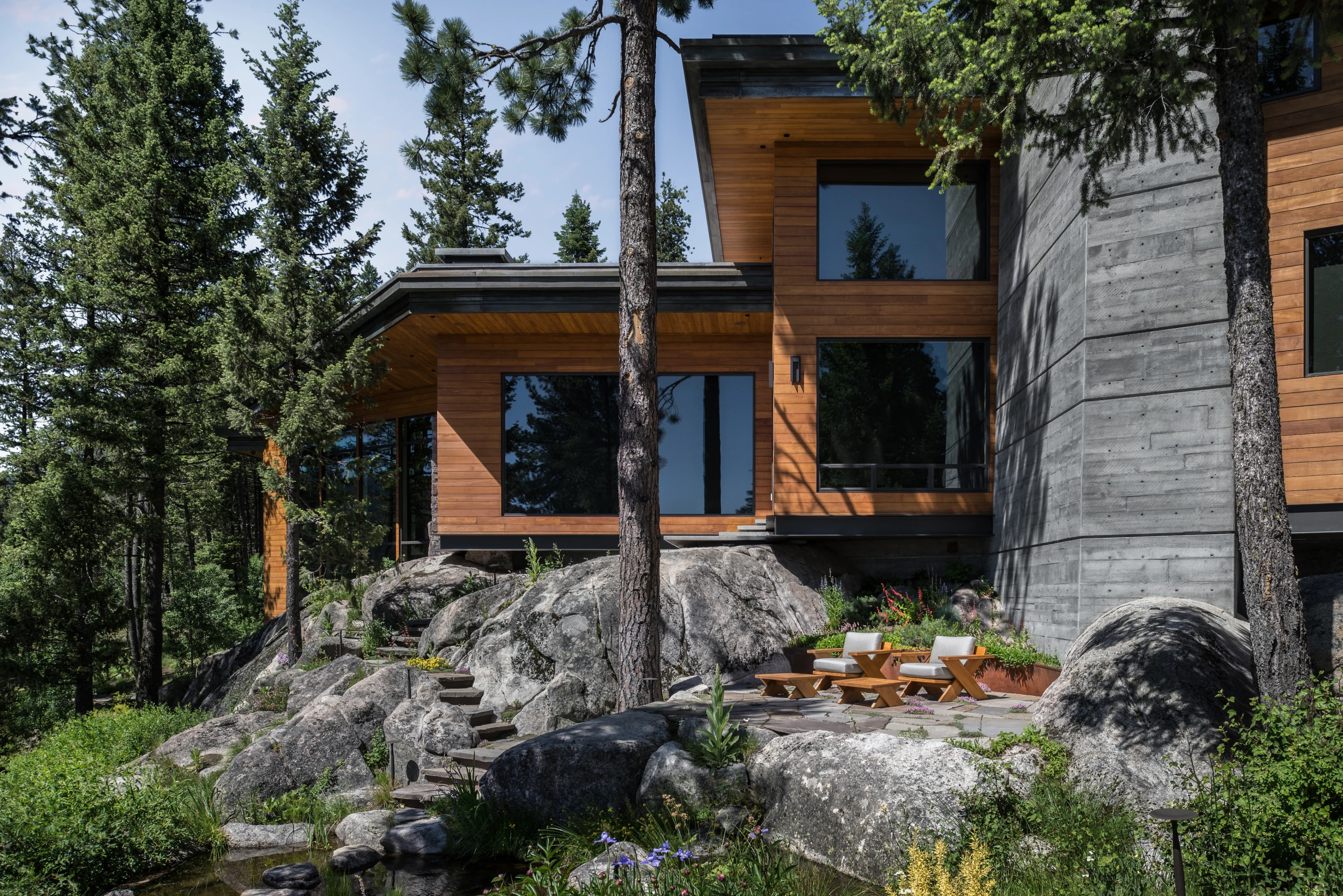The Cliff House is surrounded by dense forest and abundant granite rock