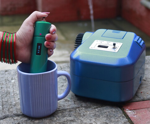 A handheld version of the device that is presently in the works (left) alongside the larger current prototype