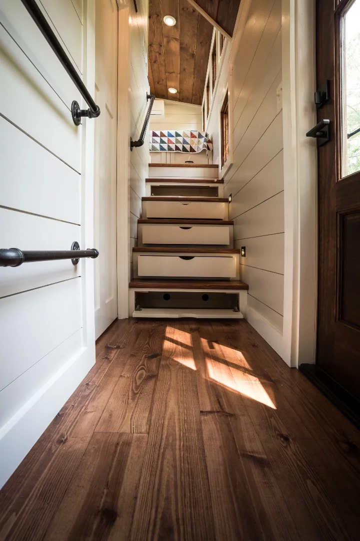 Storage-integrated staircase leads to the Denali's only bedroom
