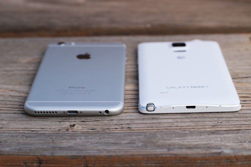 The iPhone is all metal, while the Note 4 has a plastic (faux leather) back (Photo: Will Shanklin/Gizmag.com)