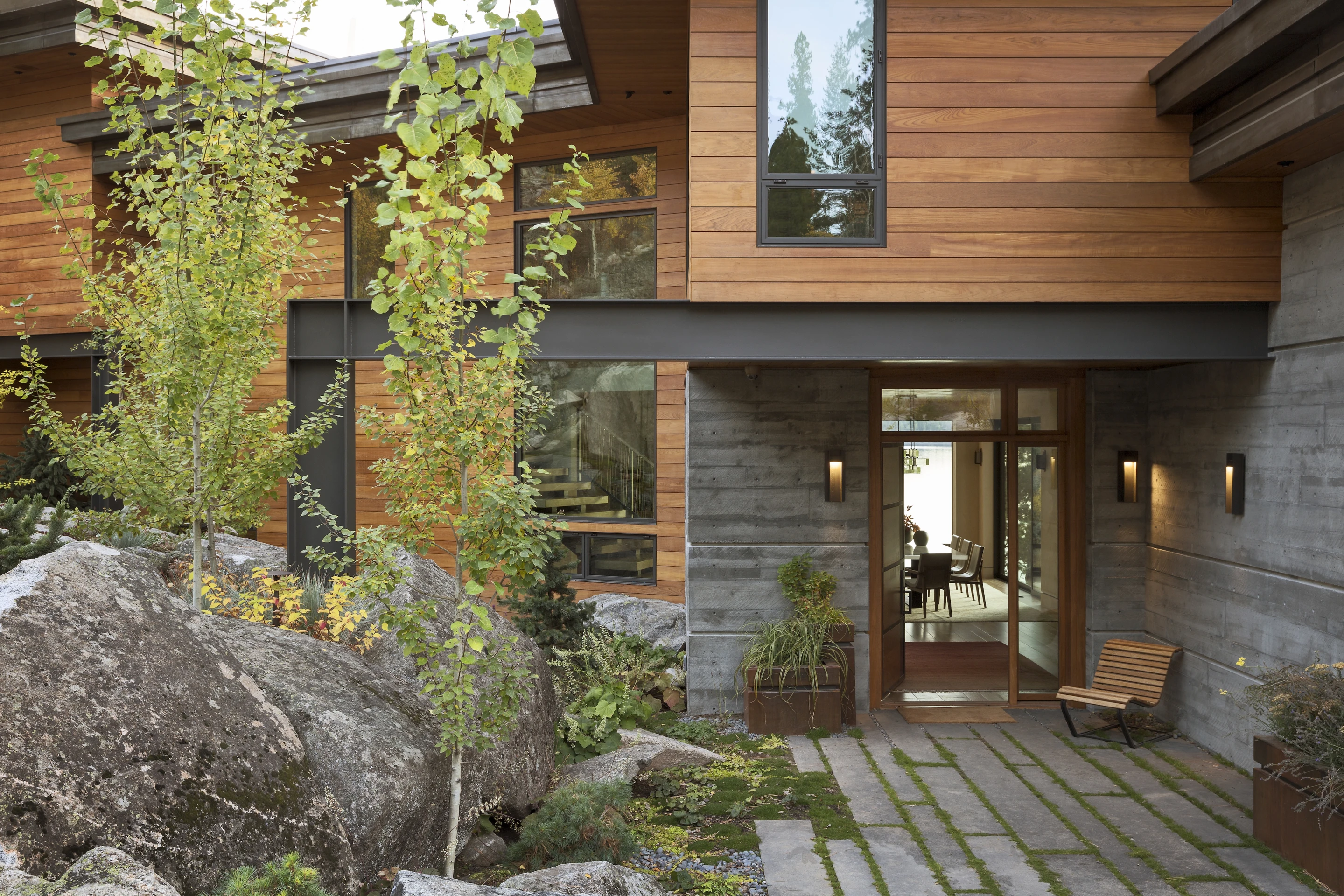 The Cliff House sits on property that features discrete rocky walkways that wind down to the lakeshore