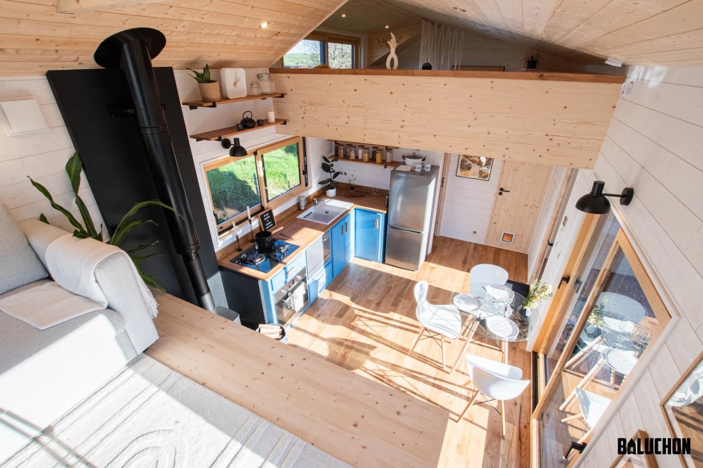 The Ivy Tiny House's interior is centered around an open and light-filled living area
