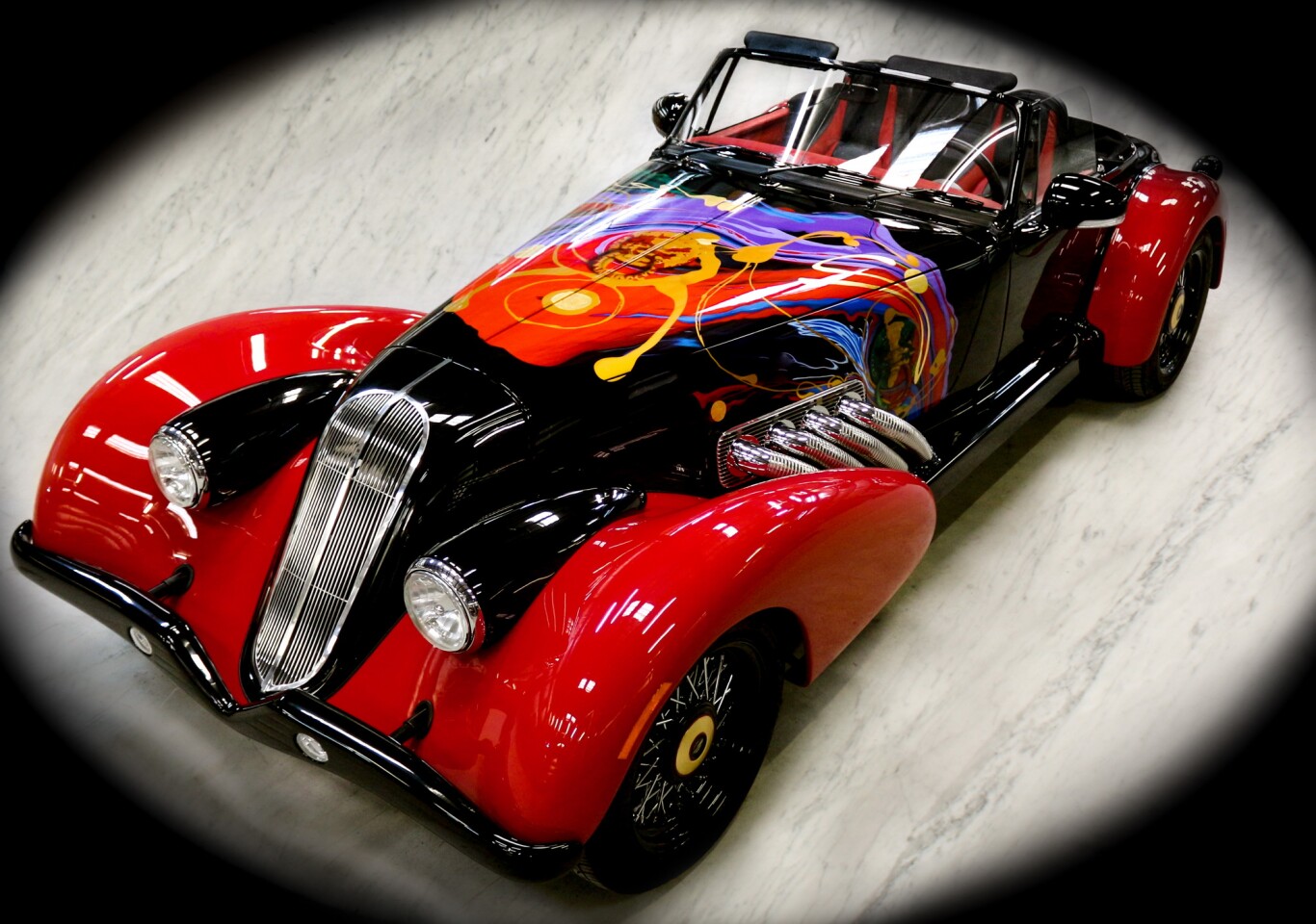 The car also sports a three-ply canvas soft top, steel body-on-frame construction and a carbon fiber body