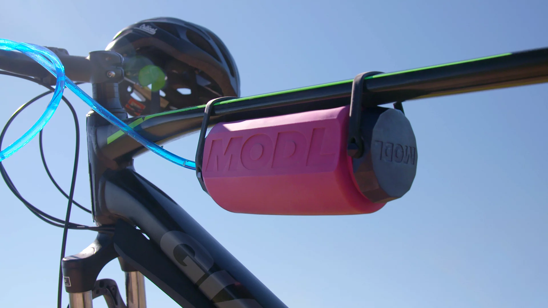 The MODL with its Flow Mod installed, mounted on a bike frame using its integrated silicone straps