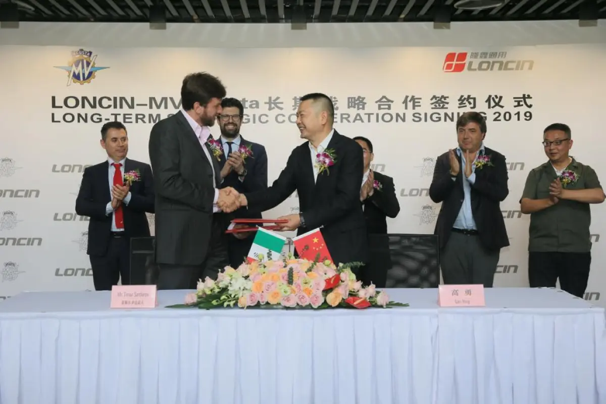 MV Agusta CEO Timur Sardarov (L) and Loncin president Yong Gao (R) shaking on their new agreement to build small-capacity MVs for the Chinese market