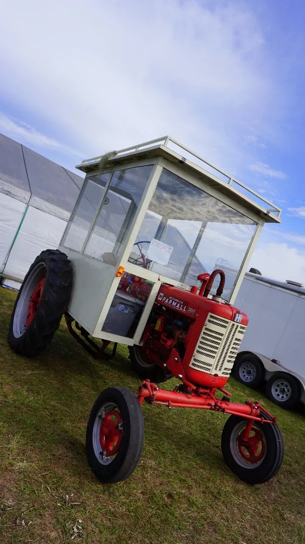 This Farmall 200 with weather enclosure reminds us of the agricultural version of the Popemobile