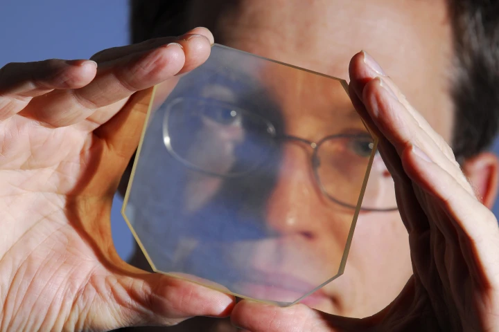Georgia Tech's David Roberts with one of the laser testing glass boards