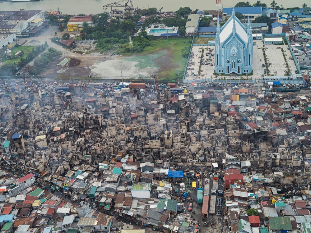 The day after a fire spread through Tondo, one of the most densely populated parts of Manila
